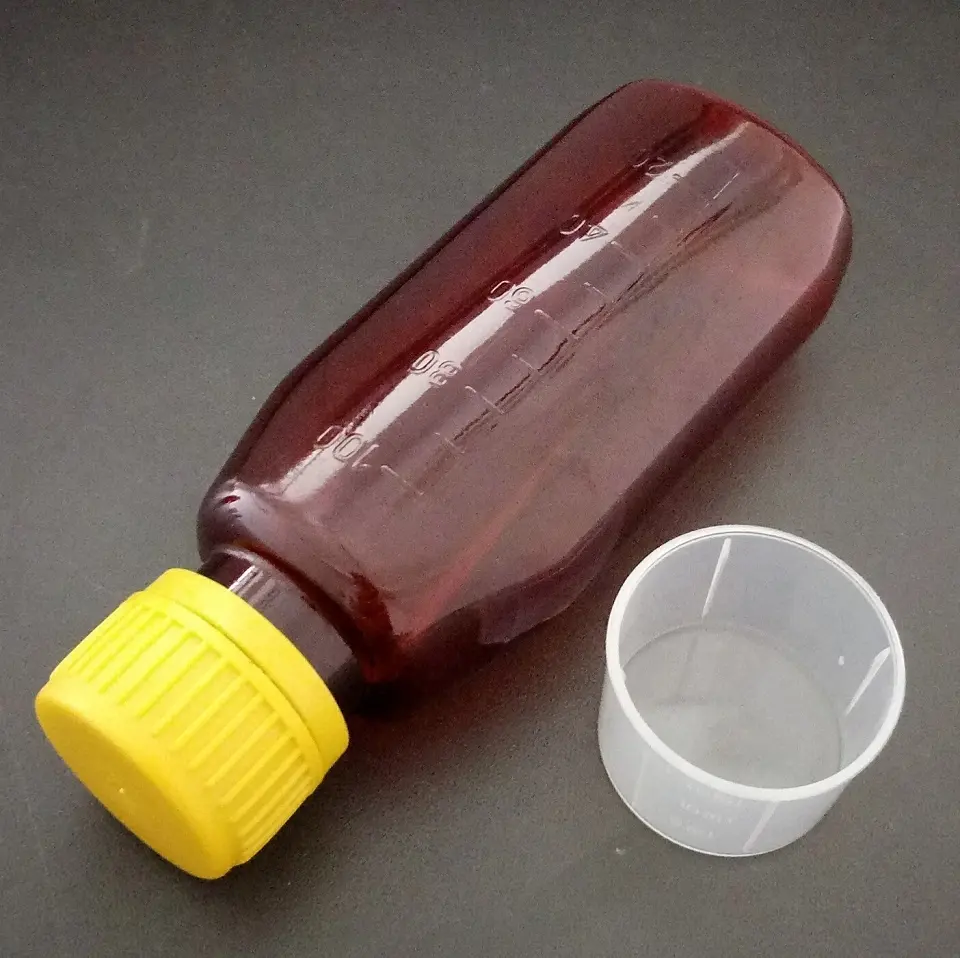 100ml âmbar garrafa PET líquido oral com 15ml copo de medição