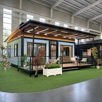 Conteneur personnalisable extensible à deux étages avec 2 chambres, panneaux sandwich, alimentation solaire et structure en acier pour villa ou bureau