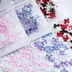 High Quality 50 Pink White Resin Ribbon Bow Day Butterfly Nail Art Decoration Professional Press Hot Wholesale Plastic Material