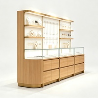 Vitrine de présentation de bijoux moderne et attrayante avec éclairage LED, dimensions personnalisables pour les magasins de détail de bijoux