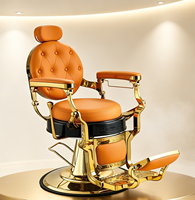 Fauteuil de barbier vintage en cuir capitonné orange avec cadre doré, fauteuil de salon hydraulique pour usage professionnel en salon de coiffure