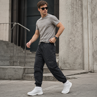 Pantalon de jogging pour homme OEM en nylon avec cordon de serrage à la taille, poche cargo zippée, revers élastiques, coutures courbées, style streetwear décontracté