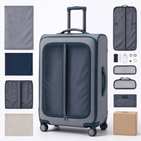 Valise à roulettes souple grise et turquoise avec compartiment avant zippé, deux poches en filet et poignée télescopique