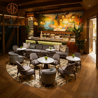 Banc de restaurant moderne personnalisé en marbre rond avec revêtement en tissu et table, mobilier de salon pour café