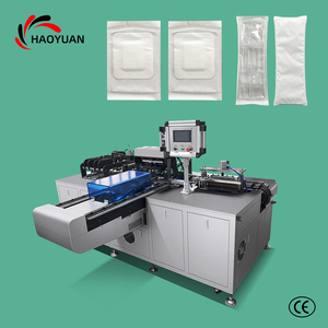 Machine d'emballage entièrement automatique et personnalisée à double poussée pour gants, kits jetables quatre pièces et autres produits - Product Image 1