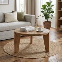 La table basse ronde élégante Anya, de 80 cm de diamètre, est idéale pour un salon chaleureux, alliant design moderne et décoration intérieure.