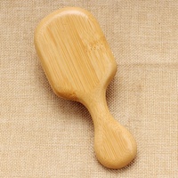 Brosse à cheveux démêlante portable mini écologique en bambou carbonisé durable avec coussin ventilé pour le toilettage quotidien et les voyages