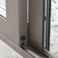 Portes de sécurité extérieures en aluminium à double vitrage sur mesure Foshan, finition en PVC, surface silencieuse, coulissant pour villa