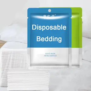 Viaje un solo uso colchas blancas sábana impermeable almohadillas cubierta desechable sábana no tejida juego de cama de hotel no tejido