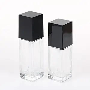 空1盎司30毫升透明方形液体化妆品玻璃瓶，带乳液泵和黑色方形盖，用于精油血清