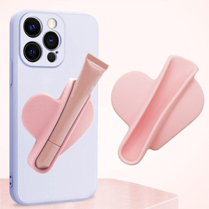 Support à rouge à lèvres en forme de cœur pour téléphone portable, support de téléphone pour baume à lèvres, support de téléphone portable en silicone auto-adhésif, support de brillant à lèvres pour le dos du téléphone avec adhésif - Product Image 1