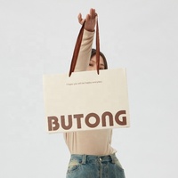 Sac cadeau en papier couché de luxe écologique de haute qualité, design découpé à la main, logo personnalisé, lamination numérique, papier épais sans couture
