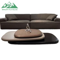 Une table basse luxueuse de style nordique à trois niveaux avec fonction rotative, idéale pour le salon.