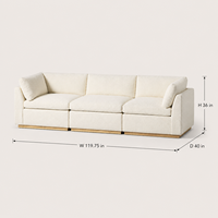 Canapé modulaire 3 places en tissu bouclé avec coussins crème et dossier bas, sectionnel avec base en bois pour salon