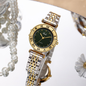 Reloj de pulsera de cuarzo para mujer, bicolor, oro y plata, con números romanos, esfera con efecto rayos de sol, brazalete de acero inoxidable - Product Image 1