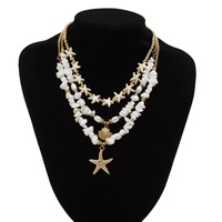 Collier multicouche en fausses perles et pierres pour femme, style bohème, avec pendentif étoile de mer et coquillage, chaîne de clavicule