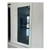 Puerta Abatible de PVC Resistente a Huracanes con Rejillas y Vidrio Insonorizado para Edificios Urbanos
