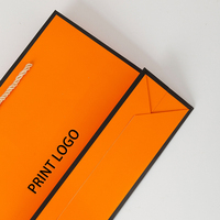 Emballages cadeaux en papier pour petites entreprises, fabricants chinois, avec poignée, sacs de vêtements de luxe personnalisés orange avec logo personnel