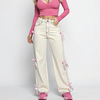 Jean baggy bleu vintage délavé avec nœud décoratif, coupe large, denim ajusté mais non serré pour femme