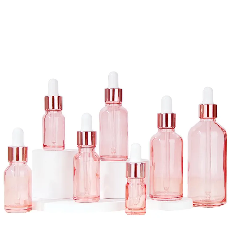 Flacon compte-gouttes rond en verre de sérum rose à l'huile 30ml 100ml flacon compte-gouttes en or rose pour les yeux flacon compte-gouttes rose pour cosmétique