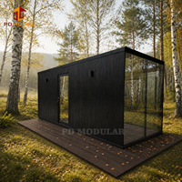 Maison d'hôtes préfabriquée en acier noir et mini-chalet pour hôtels de glamping de luxe, locations de vacances et bureaux