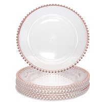 Assiettes de présentation en plastique transparent écologiques au design moderne, avec motif personnalisé en perles dorées et technique pigmentée, vente en gros pour hôtels