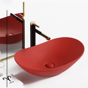工場赤い楕円形のセラミックシンクカウンターバスルームハンドアート高級洗面台磁器赤い洗面台カウンタートップ用