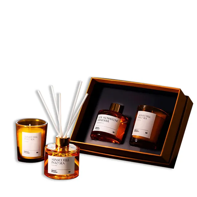 Venta al por mayor regalo de fragancia personalizada difusor de caña juegos de velas perfumadas velas de tarro de vidrio naranja para regalos de decoración del hogar