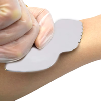 Outil de lifting anti-âge Gua Sha en acier moderne pour le massage facial myofascial du visage et du corps pour SPA