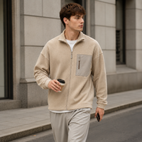 Veste de sport athlétique pour homme en maille gaufrée beige, col montant zippé avec poche poitrine contrastante, vente en gros