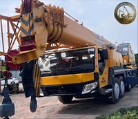 Grue de camion QY100 d'occasion à haute efficacité, grue à flèche télescopique de 100 tonnes pour travaux de construction à l'exportation