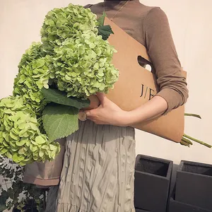 Cheap china manufacturer supplier brown kraft craft paper fresh rose bouquet packaging carrier holder flower carrier