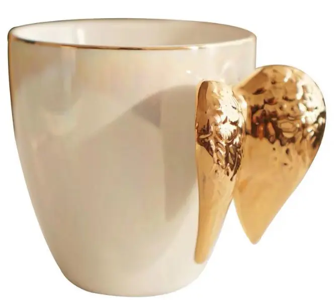 Tasse dorée fée en émail d'os de porcelaine Ailes d'ange Tasses en céramique glaçure de perles Tasse blanche en marbre 3d avec aile dorée