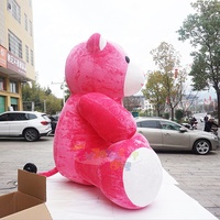 Mascotte géante de la Saint-Valentin en forme d'ours en peluche rose gonflable pour la décoration extérieure.