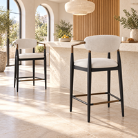 Tabouret de bar moderne avec dossier, accoudoirs en métal bronze et pieds coniques noirs, siège en tissu tissé crème pour îlot de cuisine