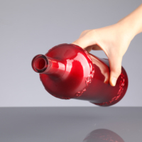 Logo en relief personnalisé 750ml galvanoplastie couleur rouge bouteille en verre de vin pour brandy rhum vodka champagne