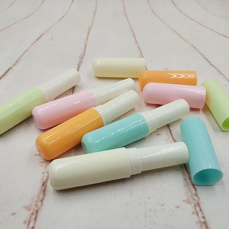 Tubo de batom vazio para cosméticos, recipiente de plástico para embalagem de protetor labial infantil, cabeça redonda cor-de-rosa bege com logotipo personalizado