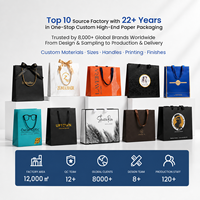 Sac cadeau pliable portable en papier recyclé imprimé avec logo personnalisé de luxe pour l'emballage de vente au détail de vêtements