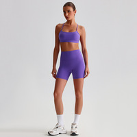 Ensemble de sport pour femme : Short de gym taille haute en nylon avec poches et soutien-gorge à bretelles croisées, idéal pour le yoga, couleur unie, vente en gros, personnalisable, pour l'entraînement