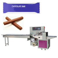 Machine d'emballage horizontale intelligente pour table, idéale pour les barres chocolatées, les snacks énergétiques, les biscuits et les produits de boulangerie.