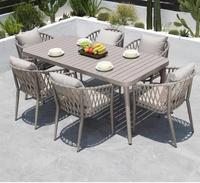 Chaise de salle à manger moderne d'extérieur en aluminium empilable et imperméable avec coussin pour hôtel, idéale pour les villas, patios et restaurants