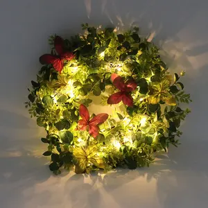 Ghirlanda di natale artificiale floccata con fiocco a sfera decorazione in pino luci a LED pre-infilate per porta d'ingresso o vetrina