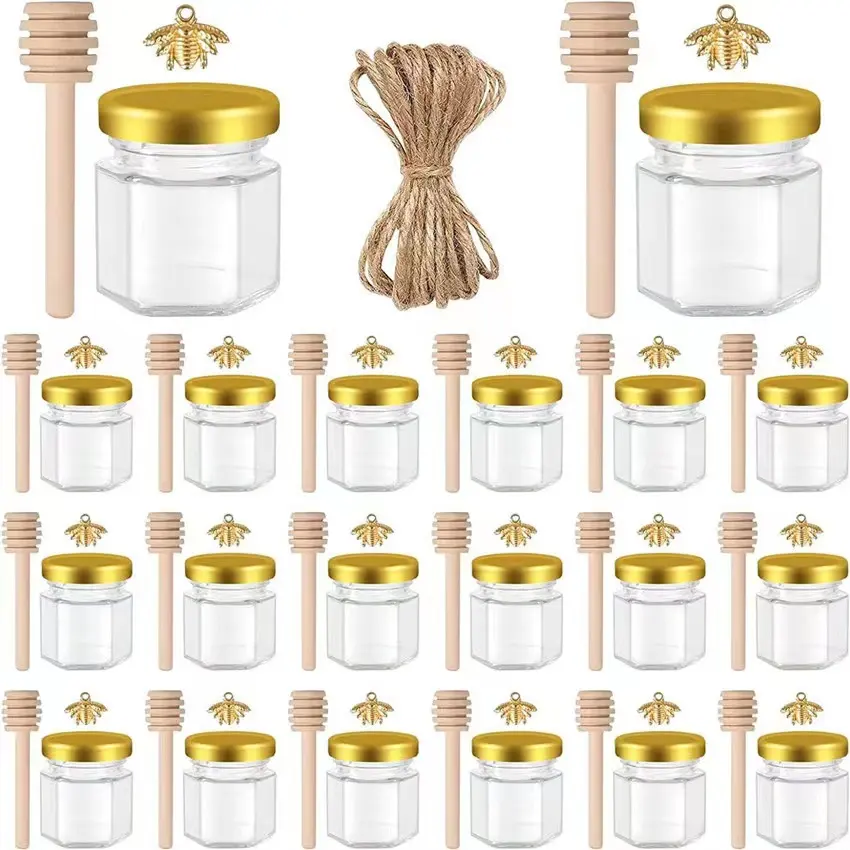 Fabricantes Unique 45ml Party Favors Honey Jar Mini Hexágonos Glass Honey Jar con cucharón de madera