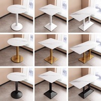 Table de salle à manger circulaire en dalle de pierre, style minimaliste de luxe, pour hôtels, zones de service de café, et commerces de desserts et de thé au lait, avec chaises