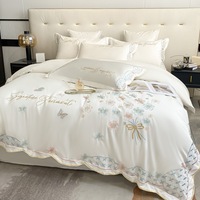 Ensemble de literie en soie véritable de style princesse d'usine ensemble de quatre pièces de drap de lit d'été brodé en soie glacée double face pour un usage domestique