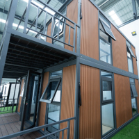 Maison conteneur extensible à deux étages et double aile, étanche, isolée, à montage rapide, structure en acier, préfabriquée, utilisable en toutes conditions climatiques