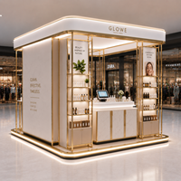 Kiosque de vente de produits de soin de la peau de luxe, îlot d'exposition pour centre commercial de beauté, éclairage LED |   Présentoir cosmétique en acier inoxydable doré écologique