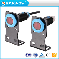 Capteur de proximité photoélectrique optique intelligent série SAKADY GL18 NPN PNP NO NC 10-30V à travers le faisceau pour la maison intelligente et l'automatisation