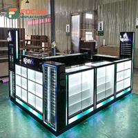 Vitrine de présentation de détail rétroéclairée en verre, écologique, robuste, étanche, personnalisable, avec îlot de comptoir et armoire LED verrouillable
