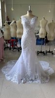 Robe de mariée haut de gamme à fines bretelles, col en V profond, dos nu, sans manches, style sirène